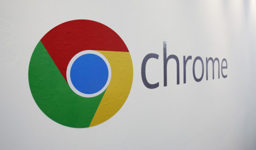 The Chrome logo is displayed at a Google event, Tuesday, Oct. 8, 2013 in New York. Google is introducing a $279 laptop that runs its Internet-centric Chrome operating system, borrowing many of the high-end features found in models that cost $1,000 or more. (AP Photo/Mark Lennihan)
